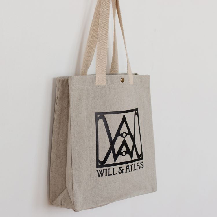 We love our new Will & Atlas branded shopper & think you will too! Made from recycled cotton, with sturdy handles & a snap closure, this is the perfect bag to keep at hand for groceries, library books or errands around town.

