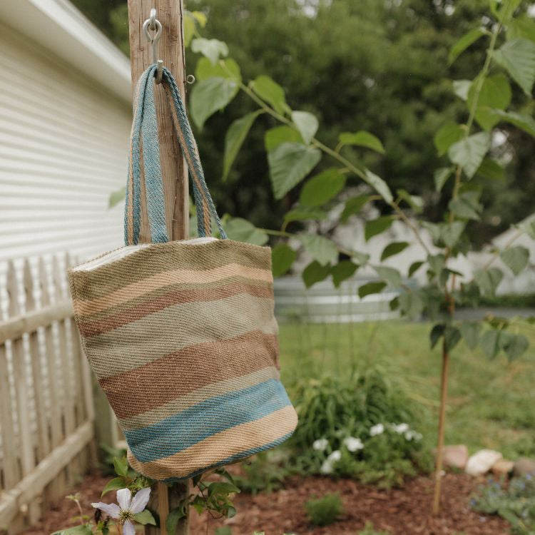 Our Sierra Striped Tote in Forest, handwoven with natural fibers.