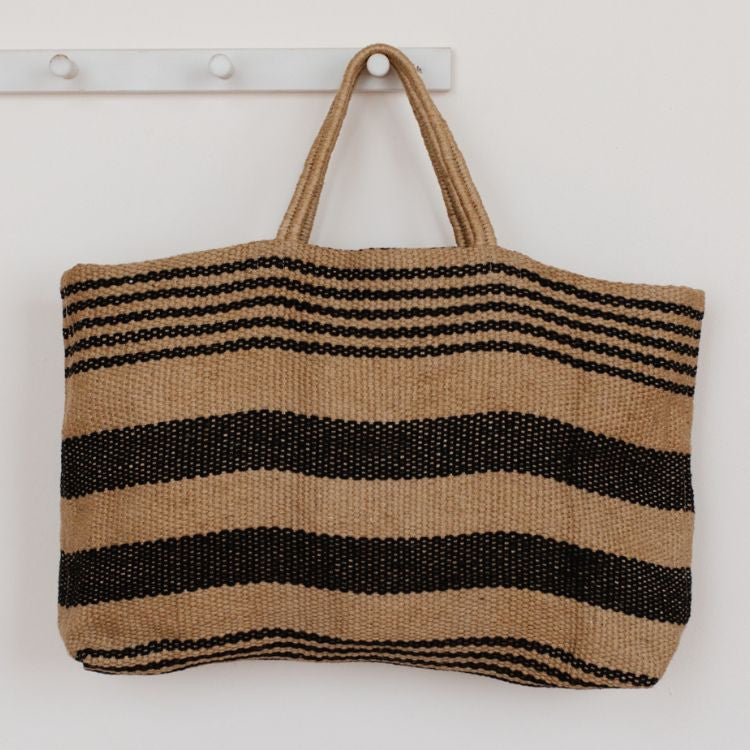 Stylish canvas tote bag with reinforced handles, perfect for groceries, beach items, and everyday essentials. The Breton Wide Market Shopper features a classic black and natural multi stripe design, by Will & Atlas.