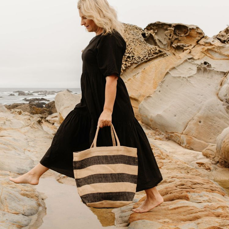 Stylish canvas tote bag with reinforced handles, perfect for groceries, books, and everyday essentials. The Brooklyn Market Shopper features a versatile black and natural design, by Will & Atlas.