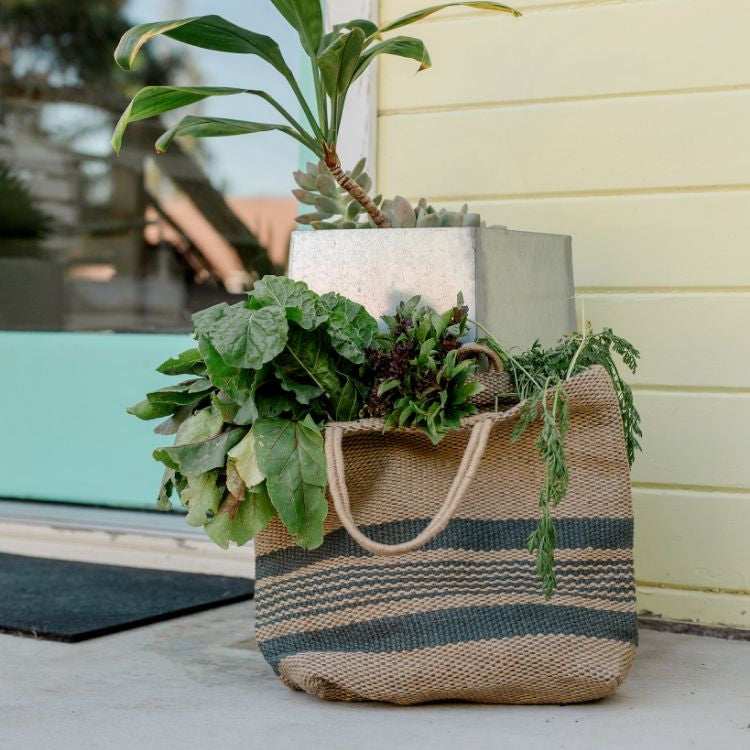Eco-friendly jute tote bag in slate blue and natural color block design, perfect for groceries, books, beach items, and everyday essentials.