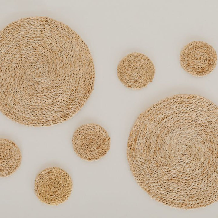 Set of 8 Handwoven Jute Round Coasters with natural tones and texture compliment an array of design aesthetic.