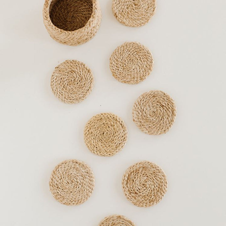 Set of 8 Handwoven Jute Round Coasters with natural tones and texture compliment an array of design aesthetic.