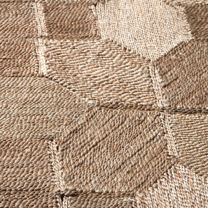 Kasba rug pattern detail of our medium-sized Kasba jute rug with natural brown colors, handwoven and sustainably sourced from fair trade producers.