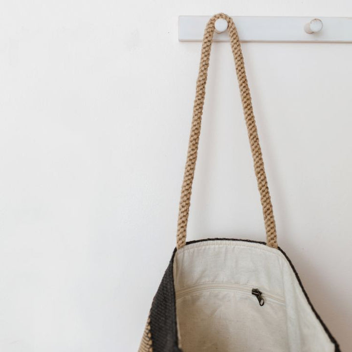 Our Khari Market Tote is handcrafted from jute, with grey, spice, or gold detailing. Whether your style is elegant minimalism or all things warm and bright, your Khari Market Tote is ready for each day’s adventures.