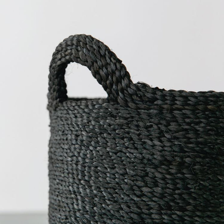 Handwoven Oval Jute Basket in charcoal, perfect for home organization and storage.