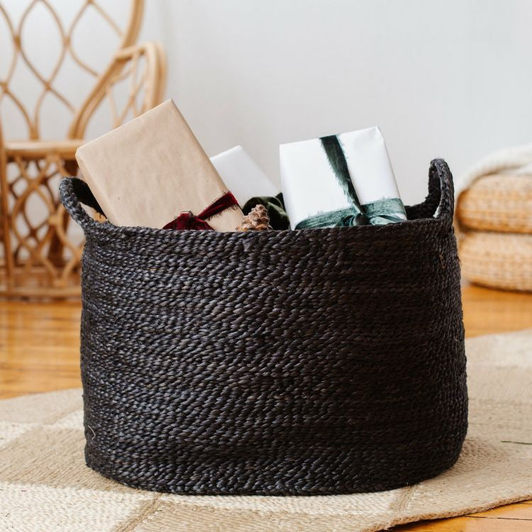 Handwoven Oval Jute Basket in charcoal, perfect for home organization and storage.