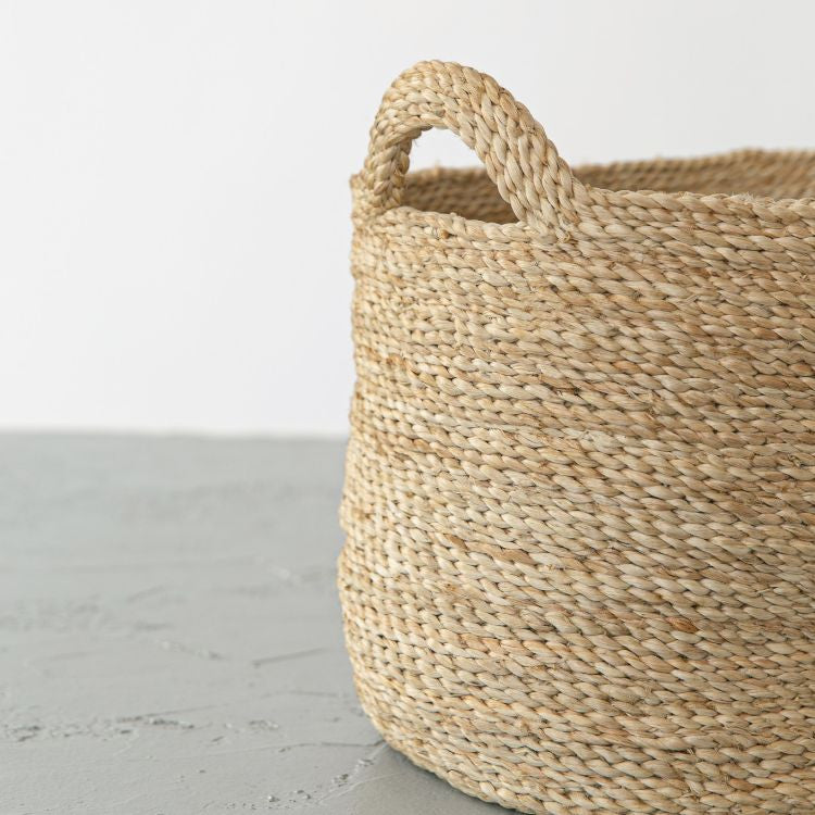 Single handwoven Oval Jute Basket in natural, perfect for home organization and storage.