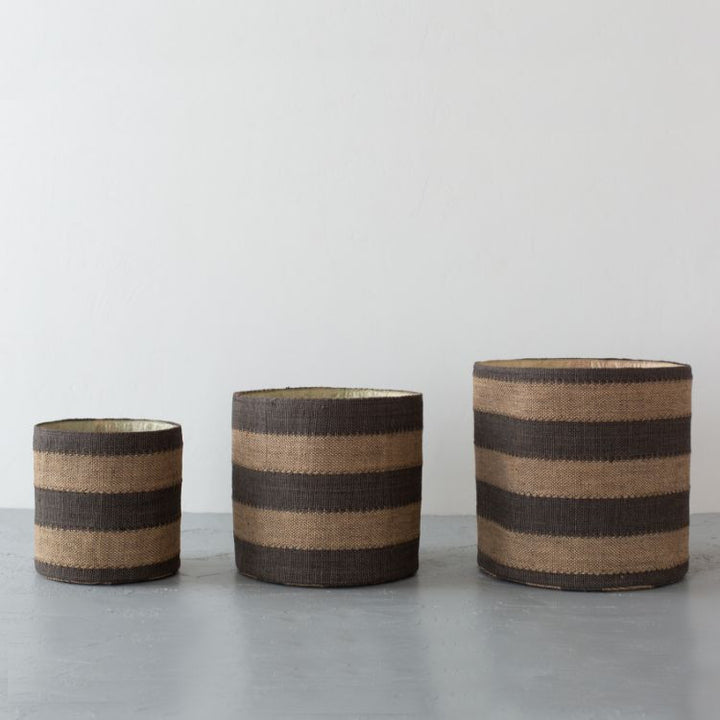 Handwoven natural cotton, Jute lined, round storage baskets with black stripes in three sizes. Perfect for storing toys, beauty products, or pantry items.