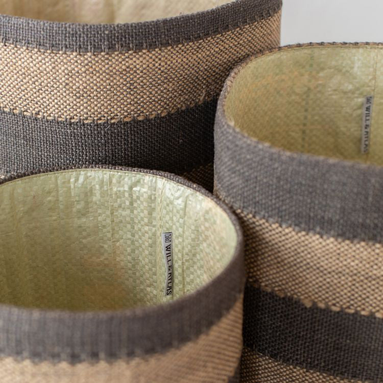 Handwoven natural cotton, Jute lined, round storage baskets with black stripes in three sizes. Perfect for storing toys, beauty products, or pantry items.