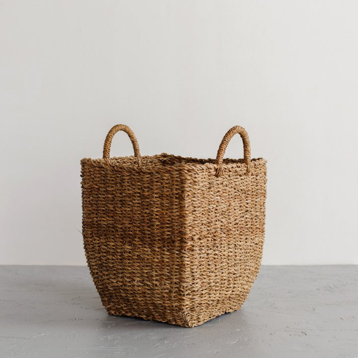A mountain of laundry becomes a thing of beauty with these gorgeous laundry baskets. The Harvest laundry basket is handcrafted from hogla grass, an aquatic plant. Woven together, it creates a design that's both lightweight and strong, with layers of natural texture and tone. (small laundry basket)

