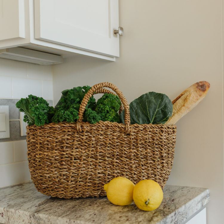 The Harvest gathering basket is handcrafted from hogla grass, an aquatic plant. Woven together, it creates a design that's both lightweight and strong, with layers of natural texture and tone.