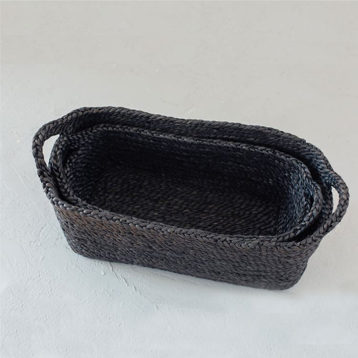 Handwoven jute rectangle tray baskets in charcoal. Perfect for organizing shelves, displaying beauty products, or lining up succulent pots. Impeccably crafted with meticulous detail by Will & Atlas.