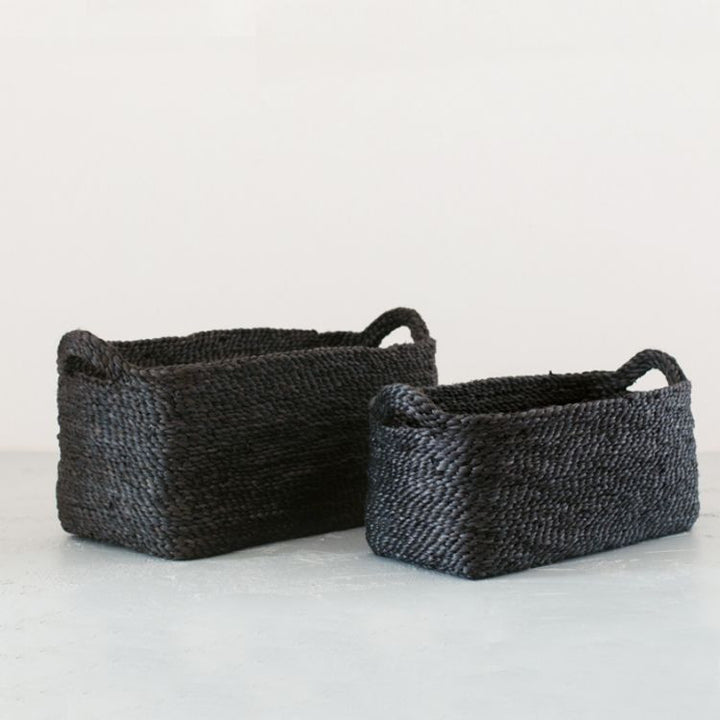 Handwoven jute rectangle tray baskets in charcoal. Perfect for organizing shelves, displaying beauty products, or lining up succulent pots. Impeccably crafted with meticulous detail by Will & Atlas.