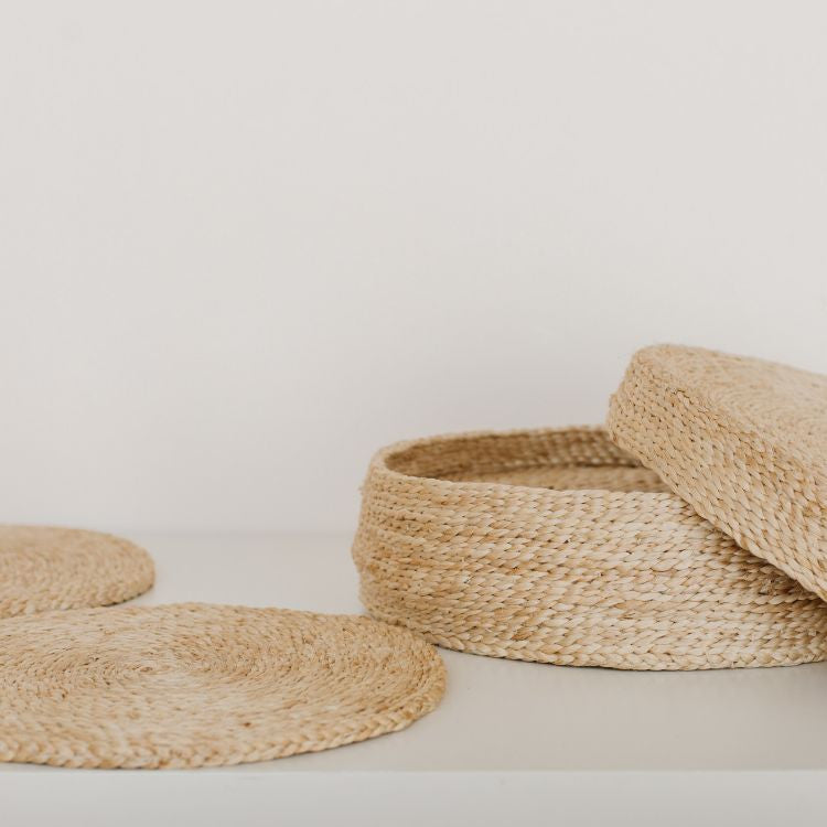 Handwoven Jute Round Placemats, Set of 8 in natural jute fibers, perfect for adding rustic charm and protecting your dining table from scratches and spills. Elegant and versatile for indoor or outdoor use.
