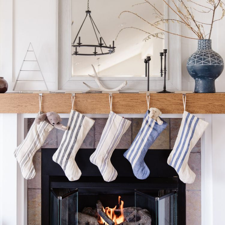 Handcrafted natural cotton ticking stripe holiday stocking with ample space for gifts, perfect for your fireplace, mantle, tree or staircase decoration.