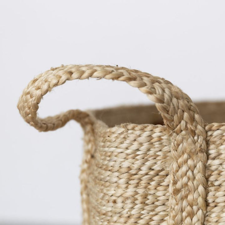 Handle detail of our large, natural jute baskets deliver on both form & function. Expertly handwoven by women working within a Fair Trade program in Bangladesh, they are built to stand up to the demands of your busy household. 