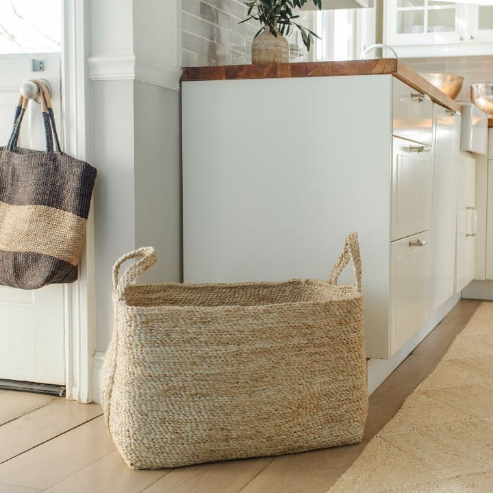 A terrific option for keeping organized, our large, natural jute baskets deliver on both form & function. Expertly handwoven by women working within a Fair Trade program in Bangladesh, they are built to stand up to the demands of your busy household. 