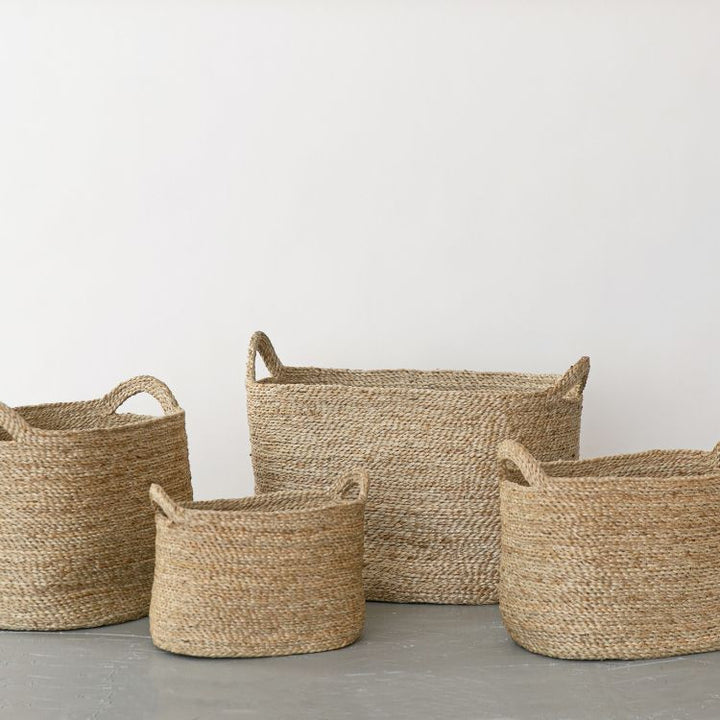 Handwoven Oval Jute Basket in natural, perfect for home organization and storage.