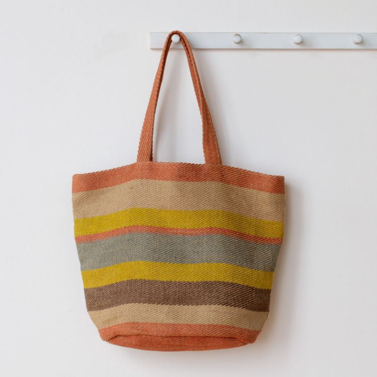 Our Sierra Striped Tote in Sunrise, handwoven with natural fibers.
